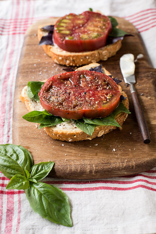 basil and heirloom tomato open faced sandwich